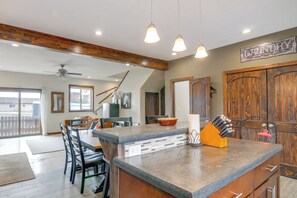 A kitchen with a central island, wooden cabinets, and pendant lighting. - 4 Mi to Hot Springs! Modern Mtn Home in Pagosa (Pagosa Springs)
