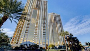 A high-rise hotel with multiple floors, large windows, and a modern architectural design. - The Rose Premium Suite at MGM Signature (Las Vegas)