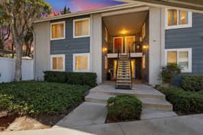 A two-story residential building with a central staircase, a covered front porch, and a well-maintained front yard. - Artful Plant-Filled Beach Rtreat W/ Pvt Backyard and 8 minutes from the Beach!! (Laguna Niguel)
