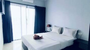 Deluxe Double Room, Pool View | Desk, laptop workspace, iron/ironing board, free WiFi
