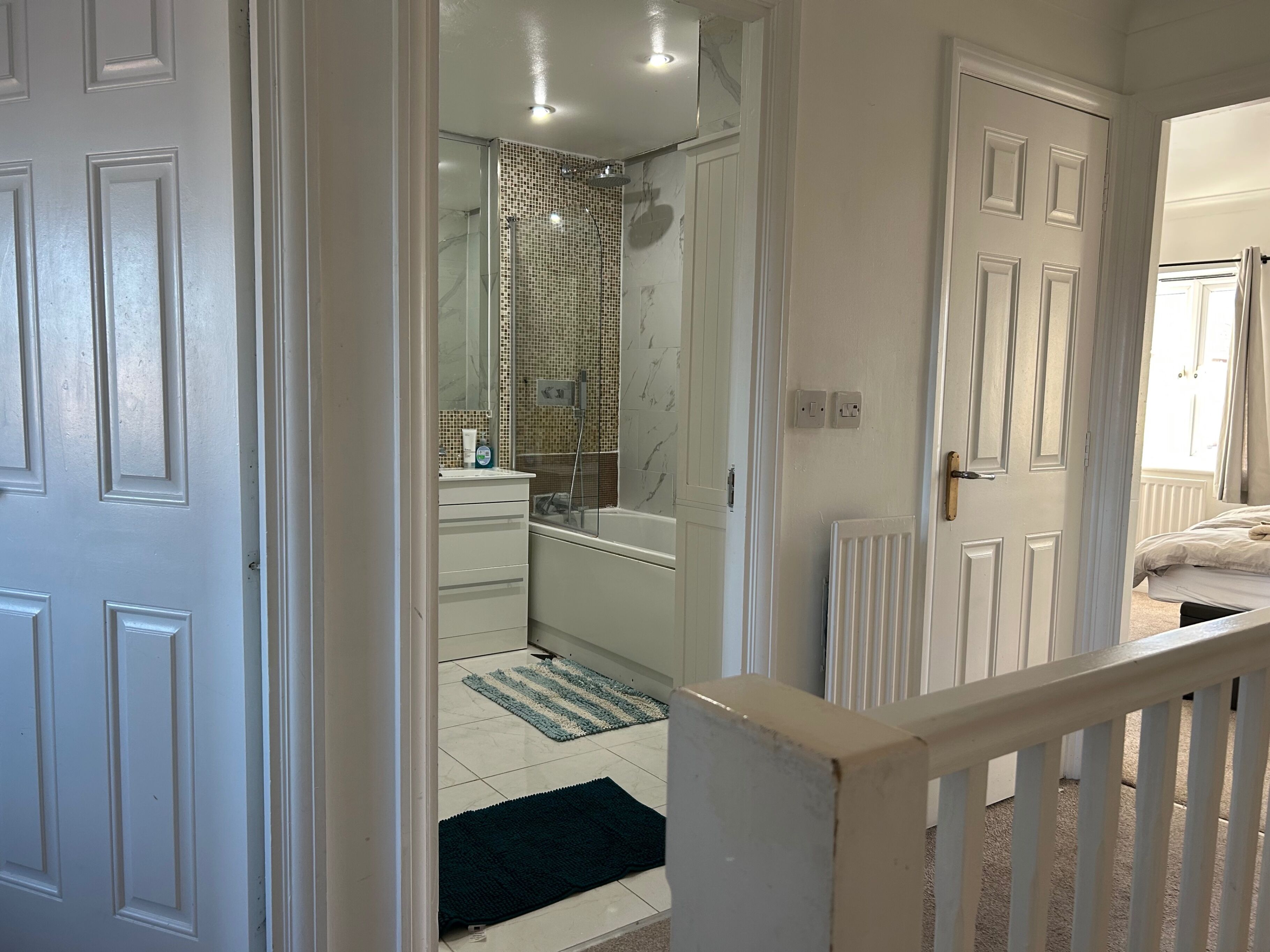 Combined shower/bathtub, deep-soaking bathtub, towels