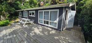 Outdoor dining - Beachfront Property in Private Bay with only 12 houses and private beach access. (Matapouri)