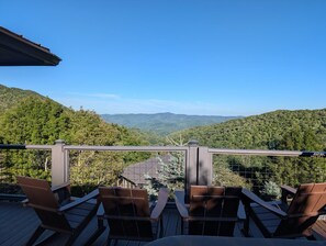 A deck with chairs overlooking a mountainous landscape. - Pet-Friendly Seven Devils Home: Huge Views + Hot Tub + Fire Table (Seven Devils)