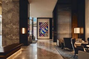 A modern lobby with a marble floor, a large abstract painting, and contemporary furniture. - Luxe Skyline Suite. Views, Heated pool, Gym, Sauna, Steam beside Crown Casino (Southbank)