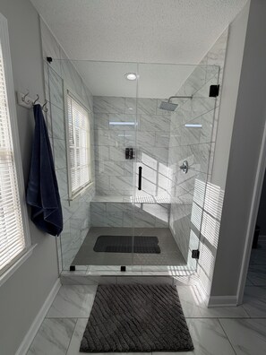 Shower, hair dryer, towels, toilet paper