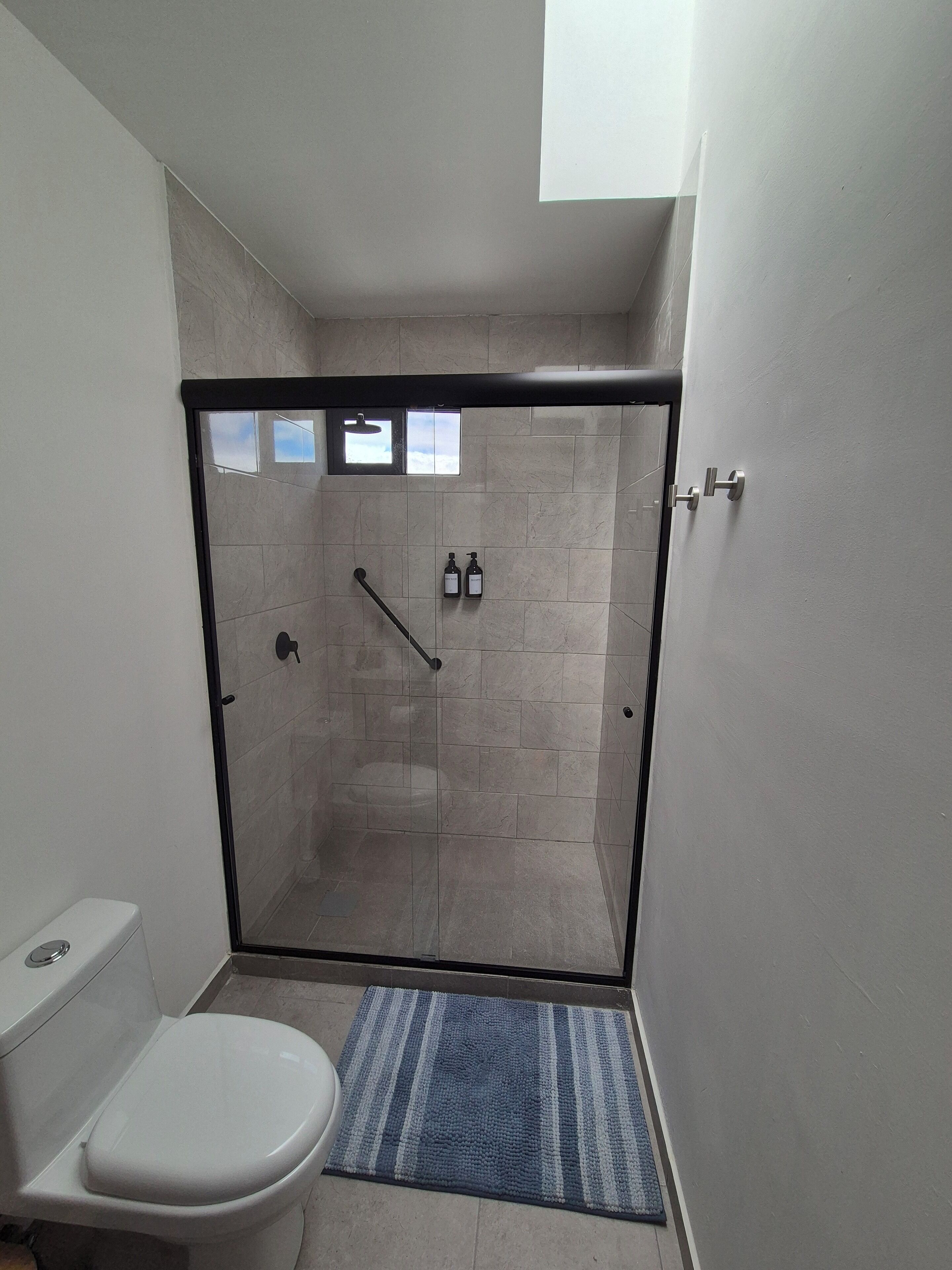 Shower, hair dryer, towels, soap