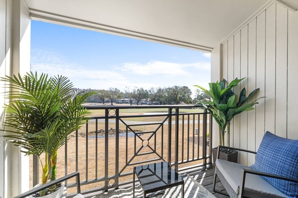 Private balcony overlooking the fairway and pond—perfect for morning coffee or sunset cocktails.