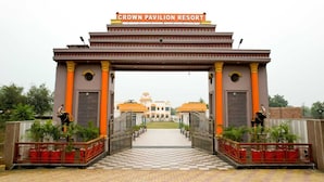 The entrance to Crown Pavilion Resort with a checkered pathway leading to the main building. - Crown Pavilion Resort  (Fatehabad)