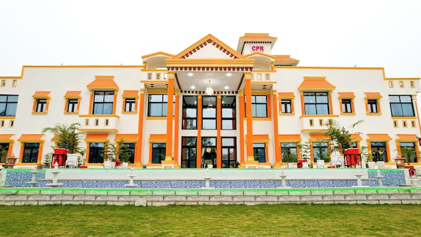 A large building with a symmetrical facade, multiple windows, and a central entrance. - Crown Pavilion Resort  (Fatehabad)