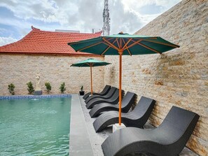 Deluxe Double Room, Patio, Pool View | Pool | Outdoor pool, pool umbrellas, sun loungers - Uli Wood Villa Jimbaran (Ungasan)