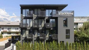 A modern building with balconies, labeled "Blackhome City Apartments." - Backhome City Apartments (Innsbruck)