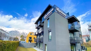 A modern building with balconies and large windows, labeled "Blackhome City Apartments". - Backhome City Apartments (Innsbruck)