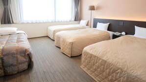 A hotel room with two beds, a nightstand, a lamp, a window with curtains, and a patterned carpet. - Hotel Sunroute Matsuyama (Matsuyama)