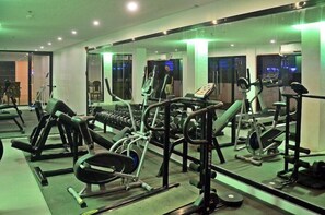 A gym with various exercise equipment, including treadmills, weight machines, and free weights. - Villa Israel Ecopark El Nido by Cocotel Powered by Fave (El Nido)