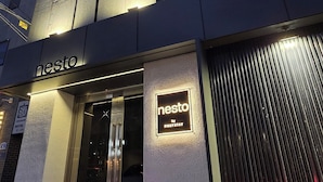 A hotel entrance with a sign reading "nesto by FirstStay". - Nesto Hongdae (Seoul)