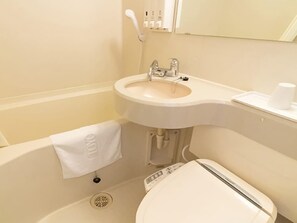 A bathroom with a white sink, toilet, and a towel hanging on the wall. - Toyoko Inn Tokyo Yamanote-sen Otsuka-eki Kita-guchi No.2 (Tokyo)