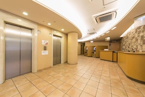 A hotel lobby with elevators, a reception desk, and a tiled floor. - R B Hotel Kyoto Eki Hachijoguchi (Kyoto)