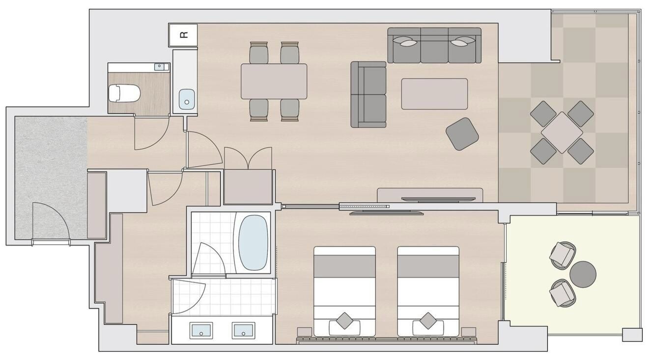 Ein Hotelzimmer mit Bad, Essbereich, Wohnzimmer und einer kleinen Küche.