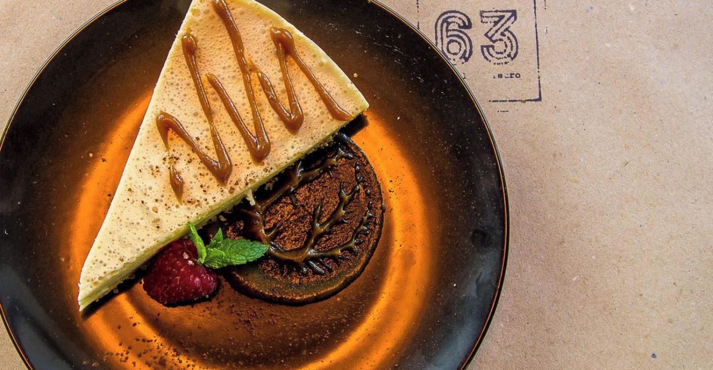 A dessert on a plate with a number '63' in the background.