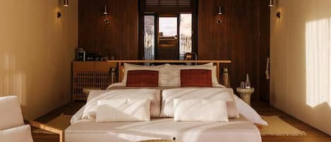 A bedroom with a large bed, a wooden ceiling, and a view through a window.