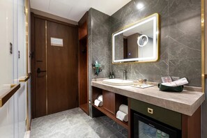 A modern bathroom with a large mirror, a sink, and a shower area. - Time Walk S Hotel Beijing University of Science and Technology Birds Nest (Beijing)