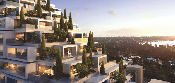 A modern multi-story building with balconies, greenery, and a view of a body of water. - City of Dreams Mediterranean (Limassol)