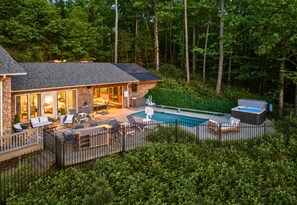 A house with a swimming pool, outdoor furniture, and a hot tub. - New Sauna, Private One Acre Lot, Saltwater Pool, New Outdoor Kitchen, Fire Pit (Hot Springs)