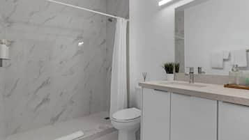 Shower, hair dryer, towels, shampoo