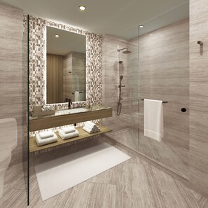 A modern bathroom with a glass shower enclosure, a wooden vanity with a mirror, and a white towel on the floor. - Intercontinental Bellevue at the Avenue (Bellevue)