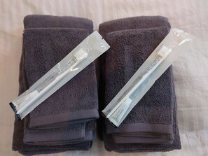 Two folded towels with a white tube of lotion on top. - Room within walking distance of Shinagawa Station / Shinagawa Ward Tokyo (Shinagawa Ward)