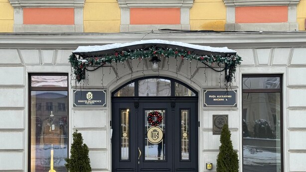 A hotel entrance with a dark blue door, two potted plants, and a sign for 'Josefin Residence'. - Hotel Iosefin Residence (Timișoara)