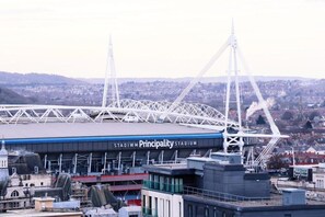 A stadium with a large, open roof structure and a prominent tower. - Standard Double Room (Cardiff)