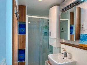 Shower, hair dryer, towels, soap