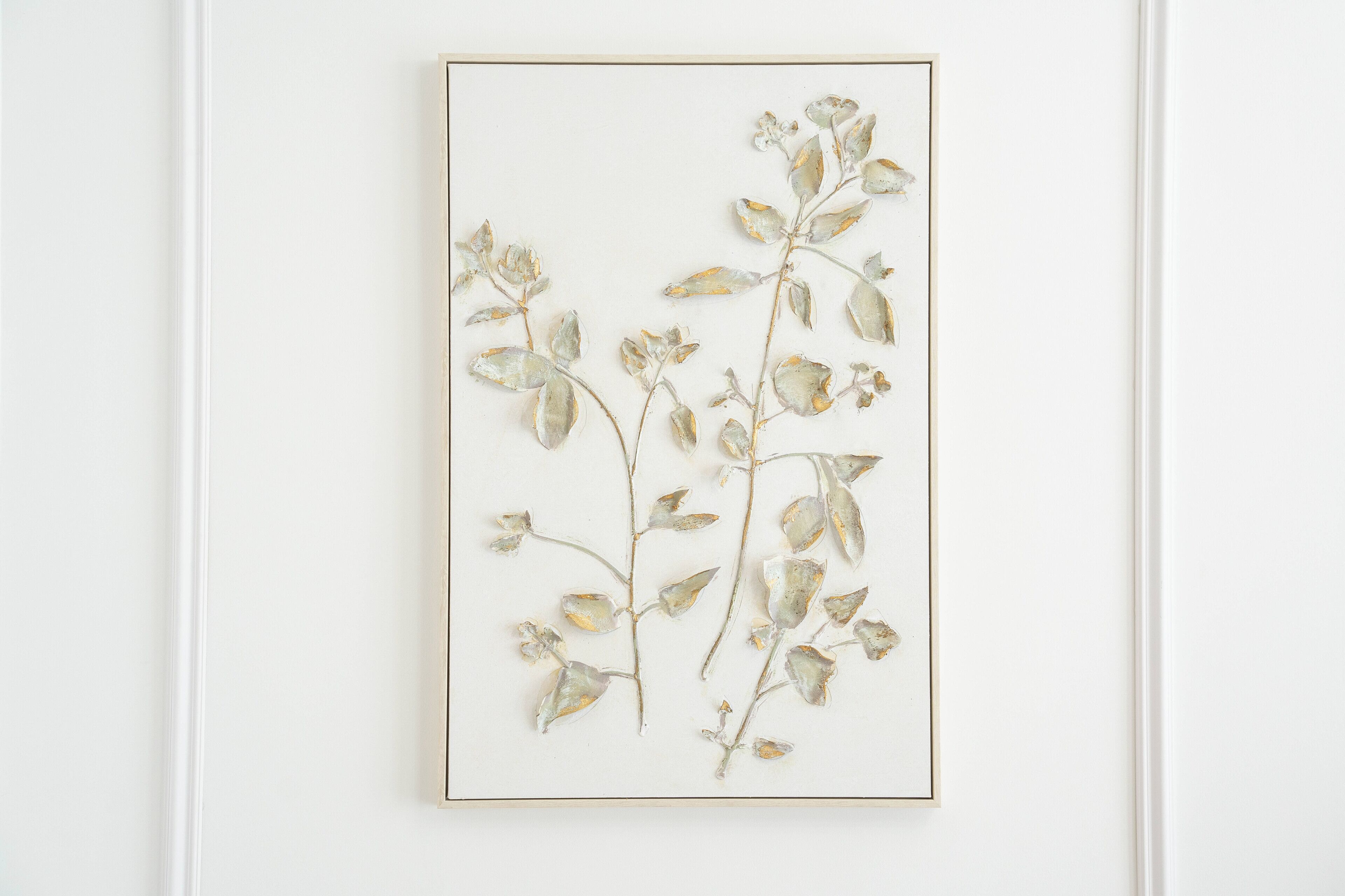 A framed botanical artwork on a white wall.