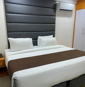 In-room safe, desk, laptop workspace, blackout curtains - Henods Luxury  Suites (Lagos)