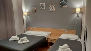 Standard Triple Room, Balcony, City View | In-room safe, desk, laptop workspace, blackout drapes