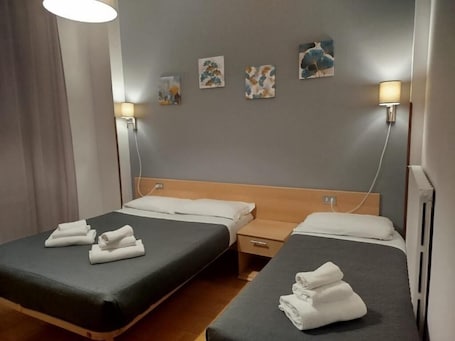 Standard Triple Room, Balcony, City View | In-room safe, desk, laptop workspace, blackout drapes. Hotel Amica