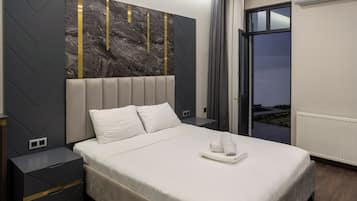 Deluxe Suite, Patio, Garden View | Blackout curtains, soundproofing, iron/ironing board, free WiFi