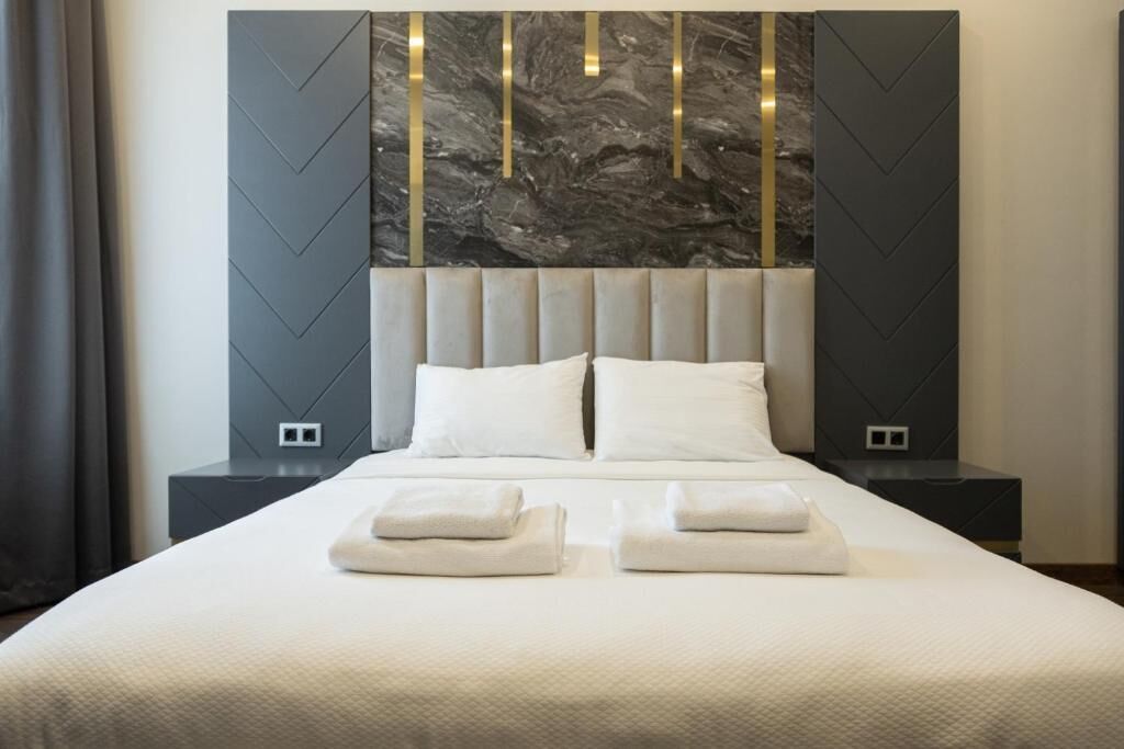 Suíte superior, sacada, vista para o mar | Cortinas blackout, quartos à prova de som, ferros/tábuas de passar roupa