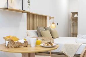 1 habitación y tabla de planchar con plancha 
