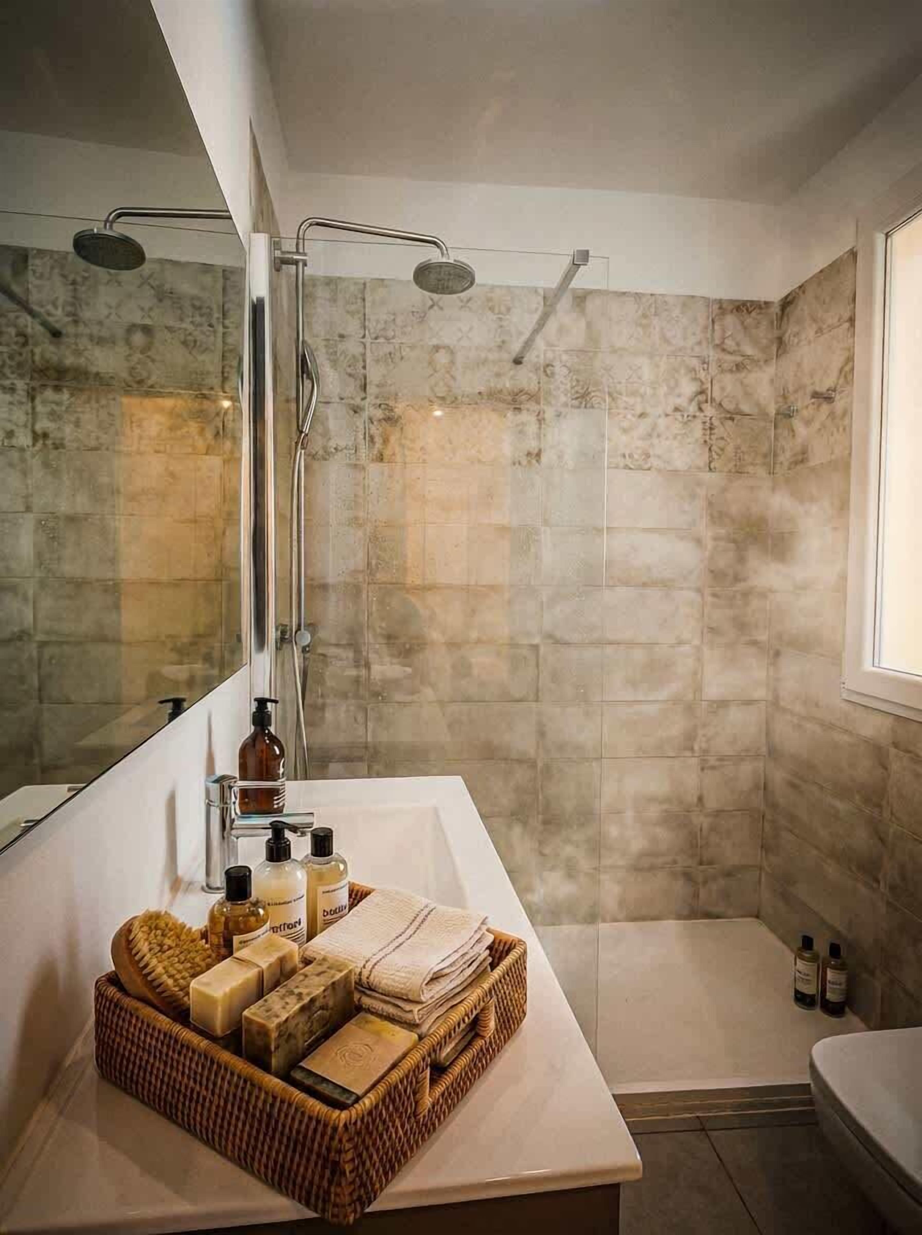 Shower, hair dryer, towels, shampoo