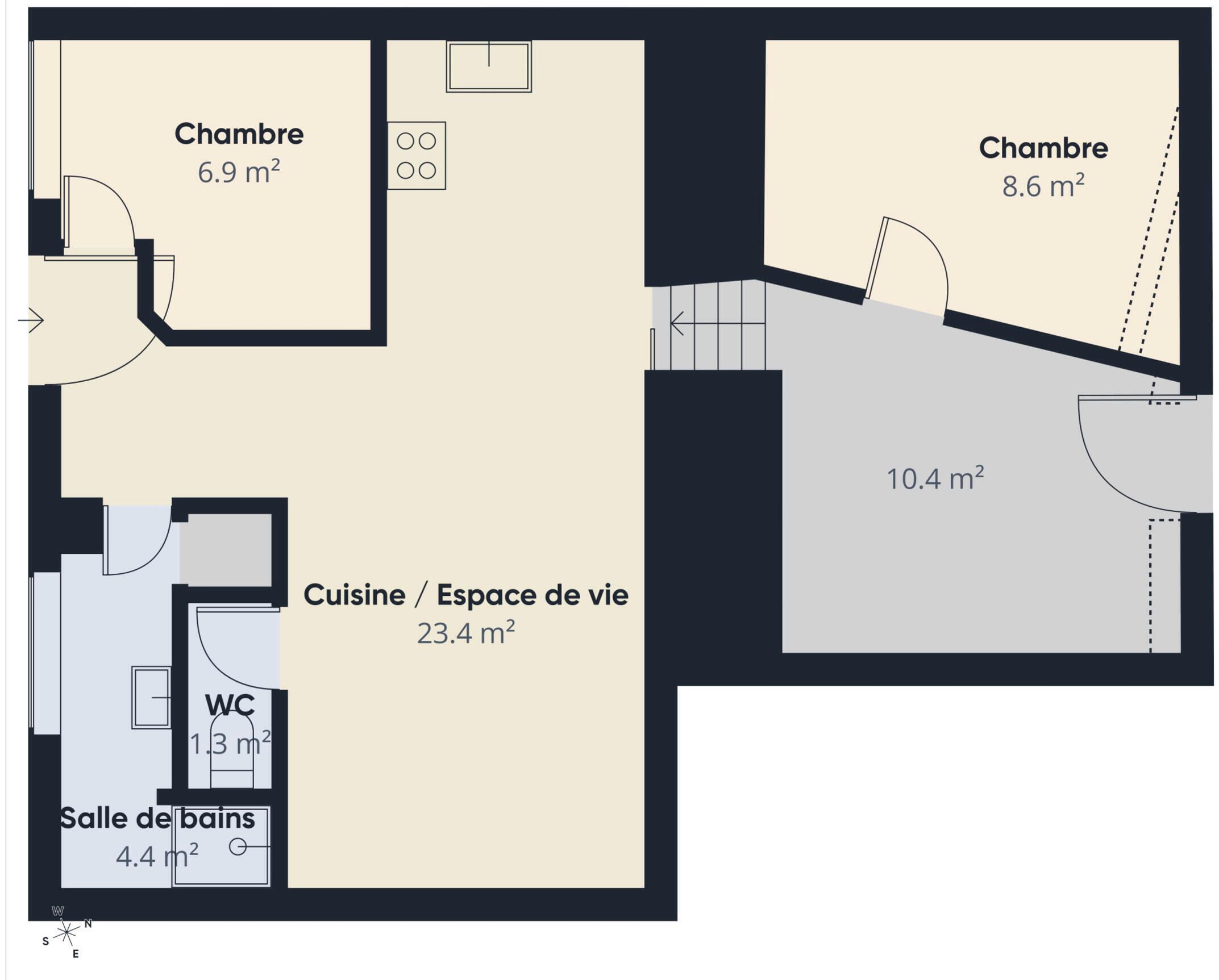 Plan d’étage d’un bien immobilier comprenant deux chambres (6,9 m² et 8,6 m²), une cuisine/pièce à vivre (23,4 m²), une salle de bain (4,4 m²) et des toilettes (1,3 m²).