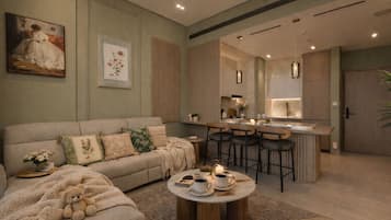Deluxe Apartment, Balcony, City View | Living area | 65-inch Smart TV with satellite channels, Netflix, streaming services