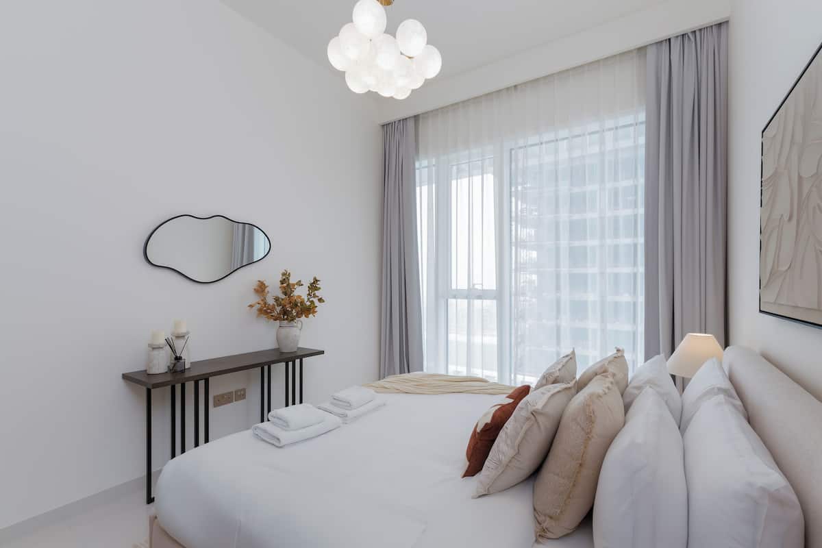 Deluxe Apartment, 1 Bedroom, Balcony, Partial Sea View | In-room safe, desk, laptop workspace, blackout drapes