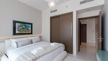 Premium Apartment, 1 Bedroom, Balcony, Partial Sea View | In-room safe, desk, laptop workspace, blackout drapes