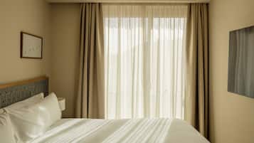 In-room safe, desk, laptop workspace, blackout curtains