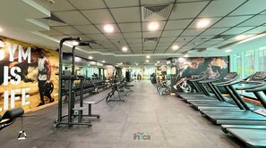 A gym with treadmills, weight machines, and a motivational wall. - 77 Floor Luxury 1Br Marina Sea View Balcony (Dubai)