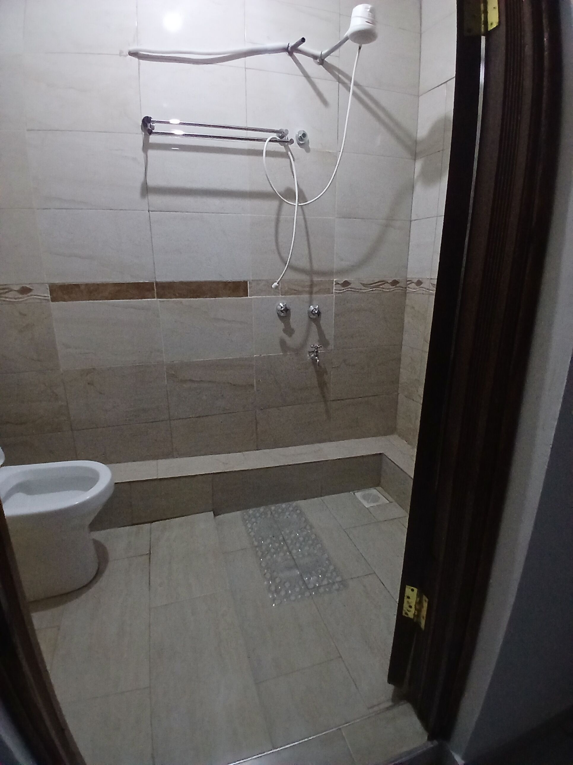 Shower, towels, soap, toilet paper