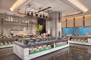 A modern buffet setup with multiple serving stations, a variety of food containers, and a central decorative floral arrangement. - Hampton by Hilton Ningde Lithium Electricity Town (Ningde)