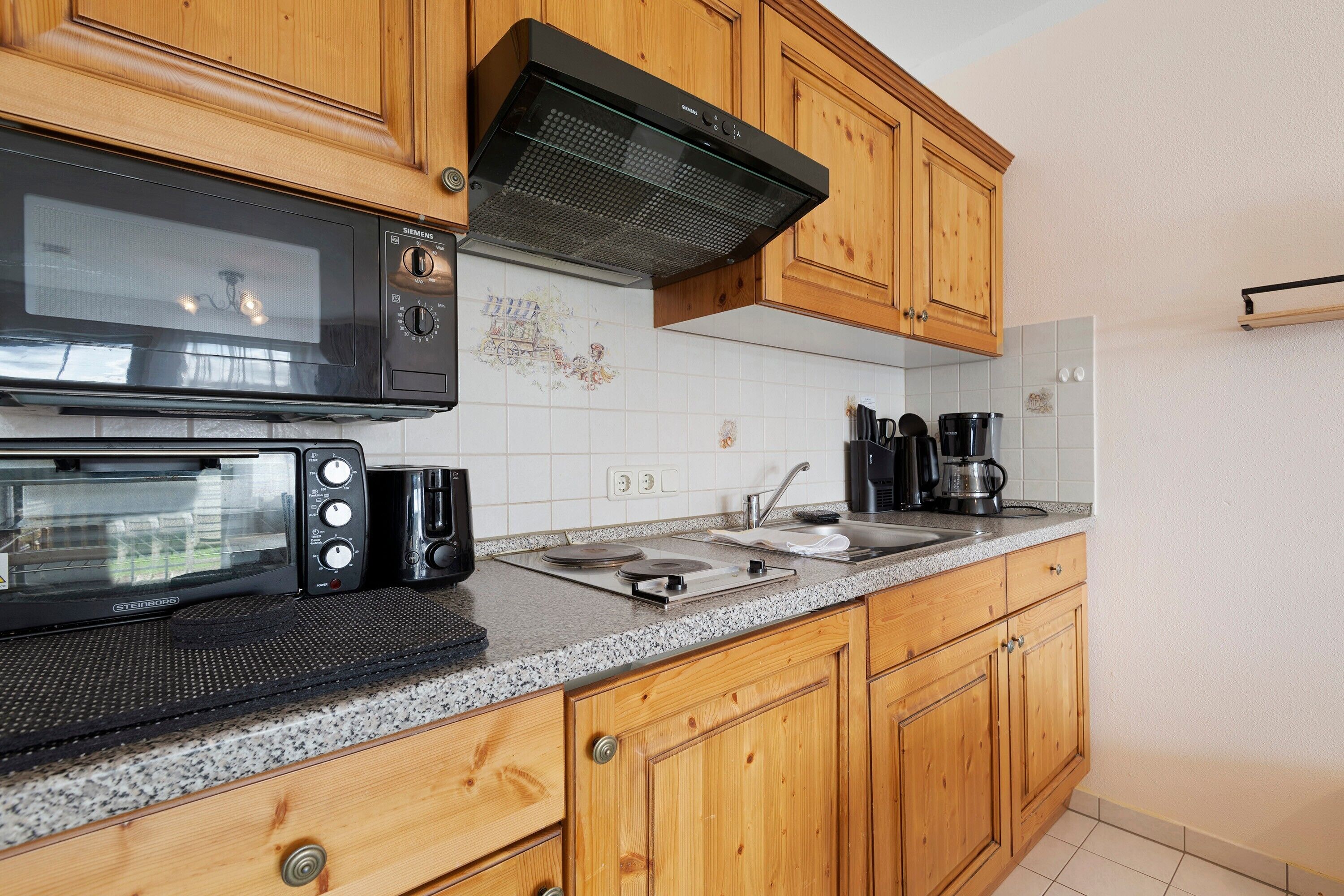 Fridge, microwave, stovetop, coffee/tea maker
